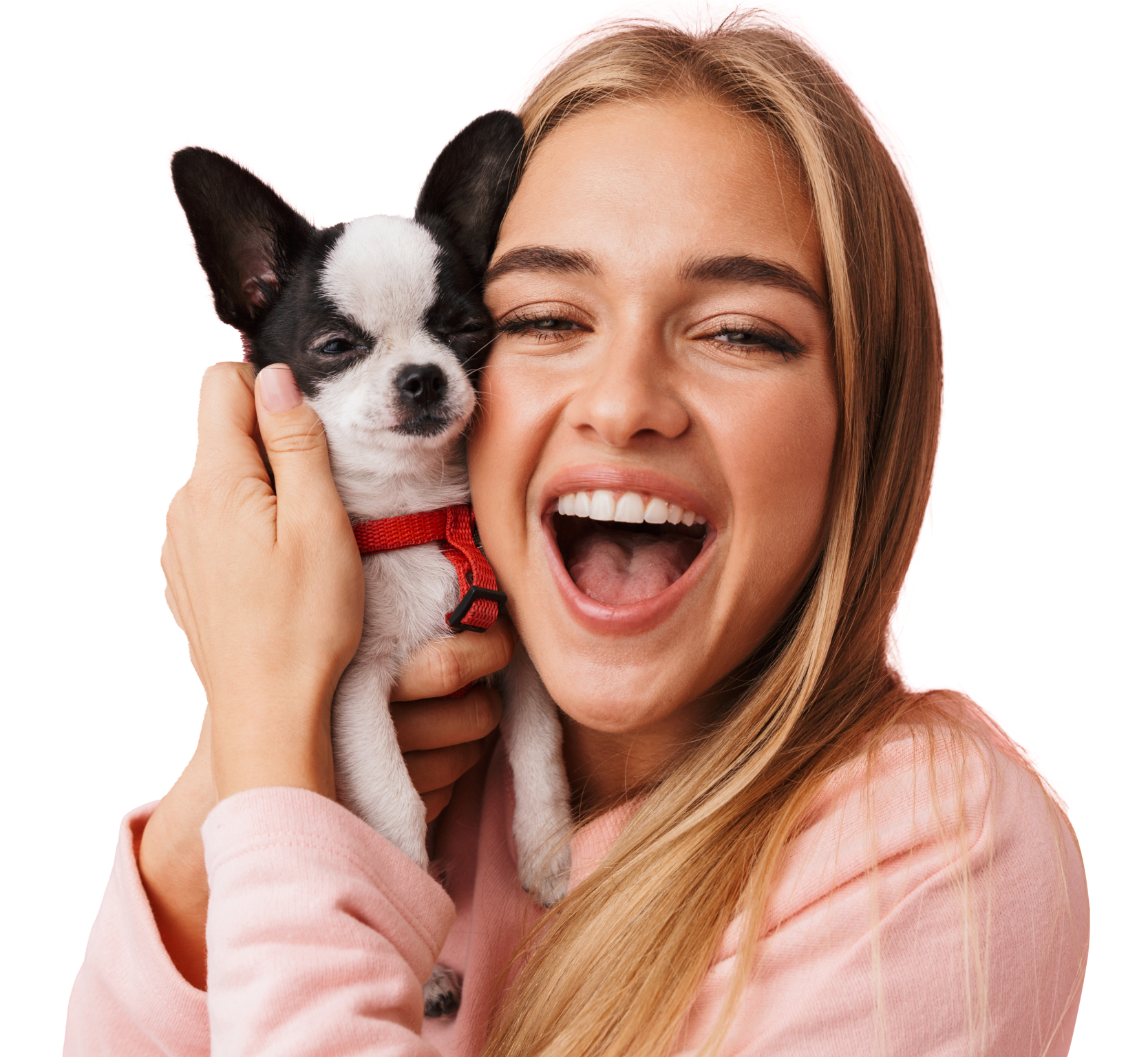 A woman smiling while hugging a dog